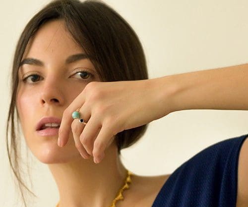 Elegant Larimar ring featuring a tiny, vibrant blue gemstone on a delicate band. Perfect for adding a subtle pop of color.