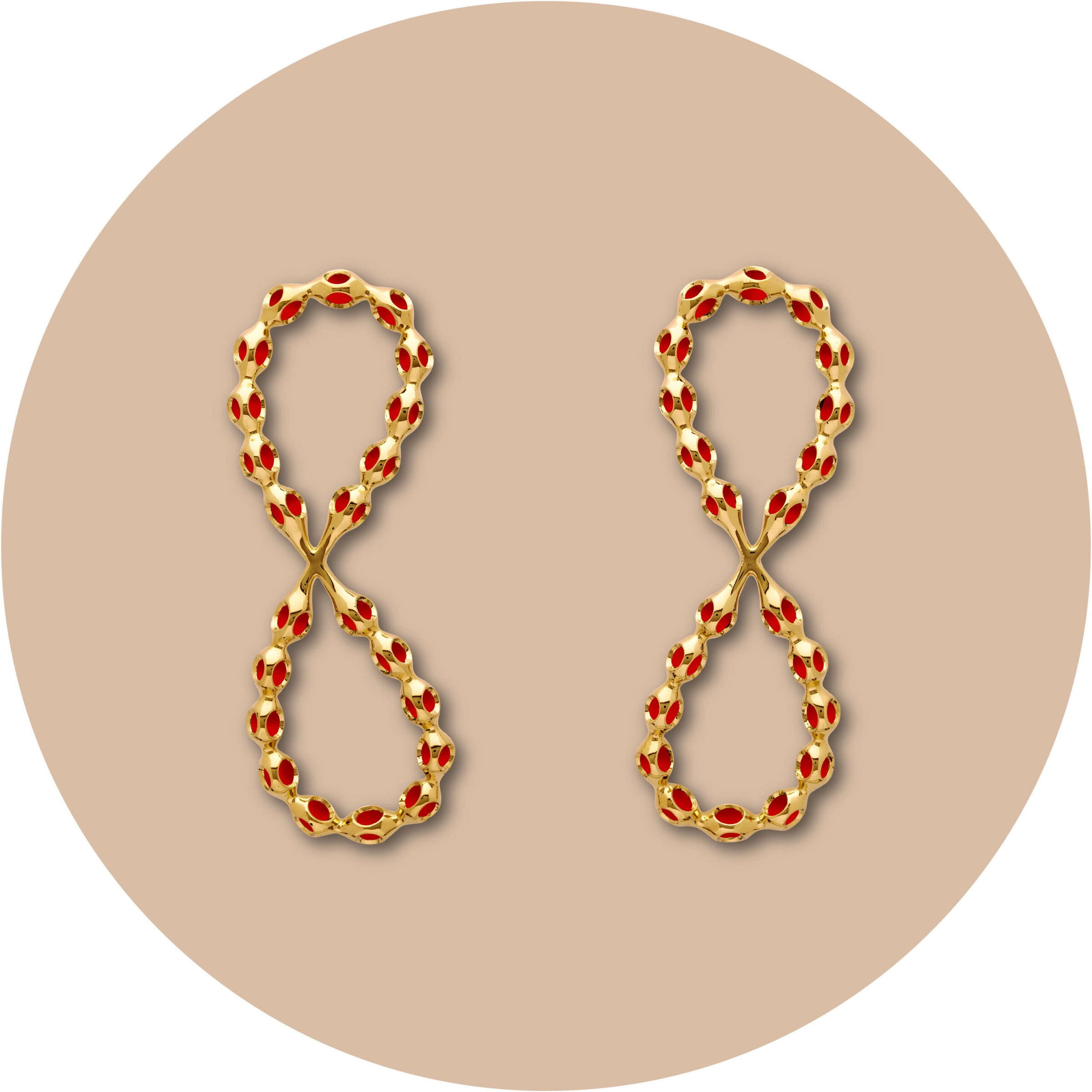 Luxury gold chain earrings with red enamel accents, stylish and trendy jewelry accessory.