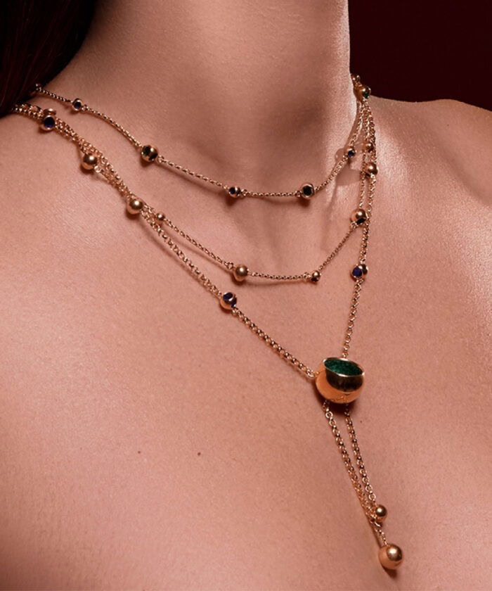 High-quality layered gold necklaces featuring colorful gemstones, perfect for elegant fashion.