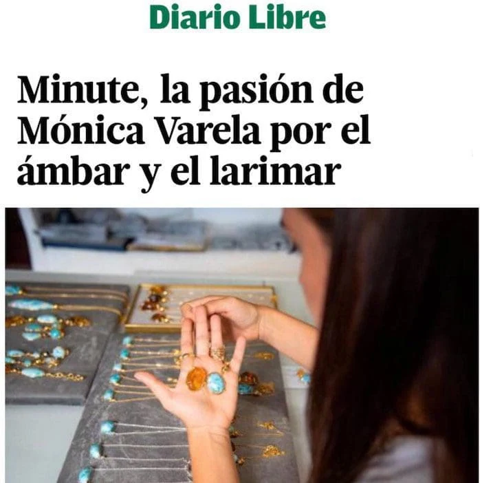 Close-up of Monica Varela browsing gold and gemstone jewelry at a store.