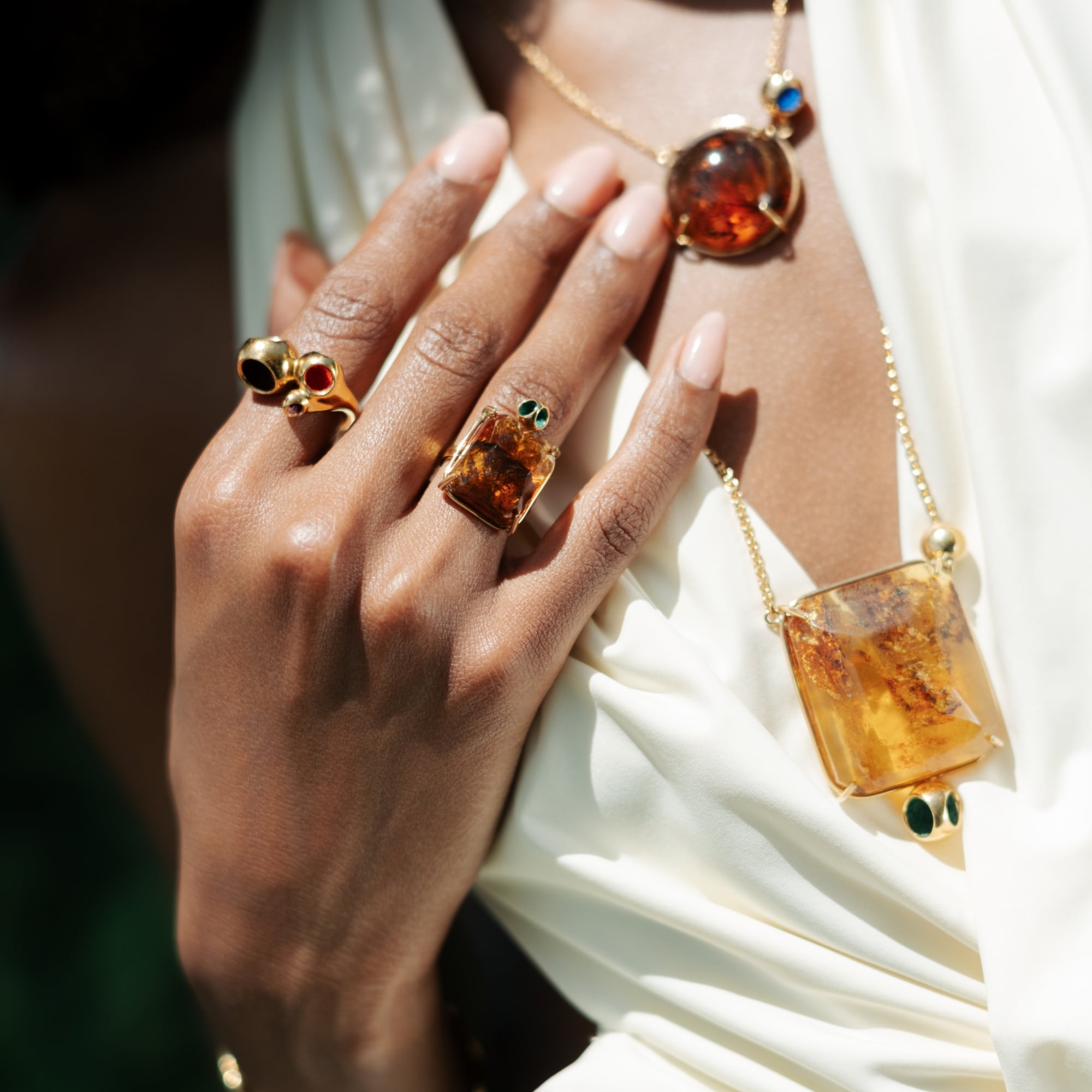 Dominican amber pendant and rings worn by model