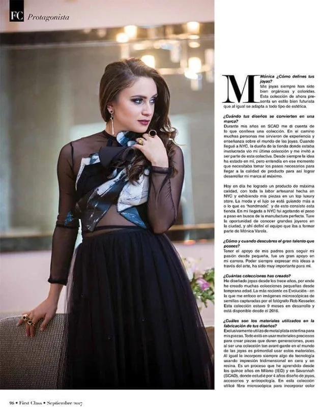 Cute young woman showcasing jewelry at an event.