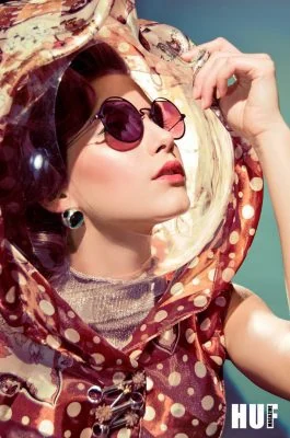 Glamorous Monica Varela fashion shot emphasizing vintage style and accessories.