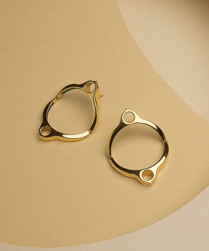 Elegant gold hoop earrings with a modern design, perfect for stylish accessory upgrades.