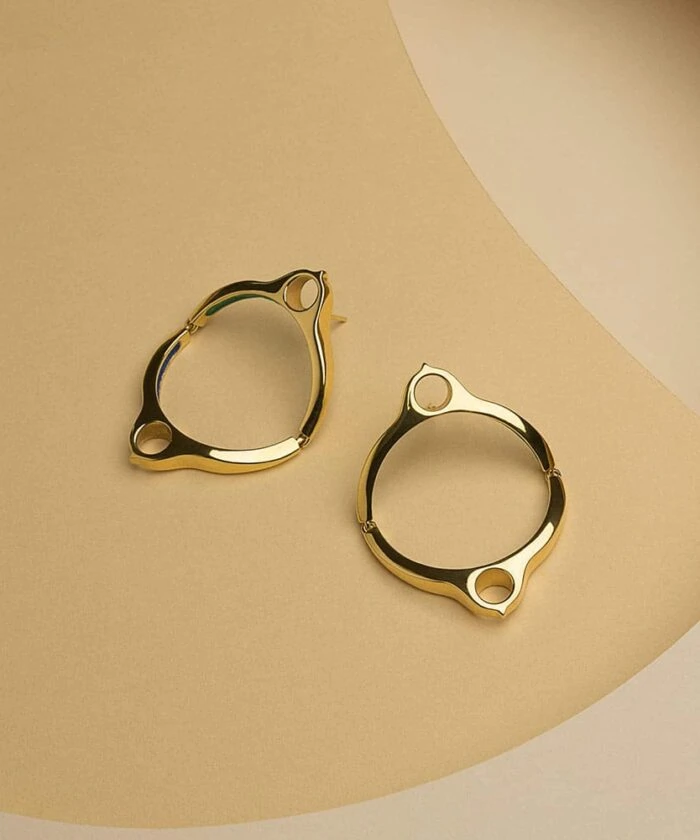 Elegant gold hoop earrings with a modern design, perfect for stylish accessory upgrades.