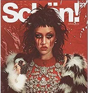 Varela in bold fashion with dramatic makeup and striking outfit for Schon Magazine feature.