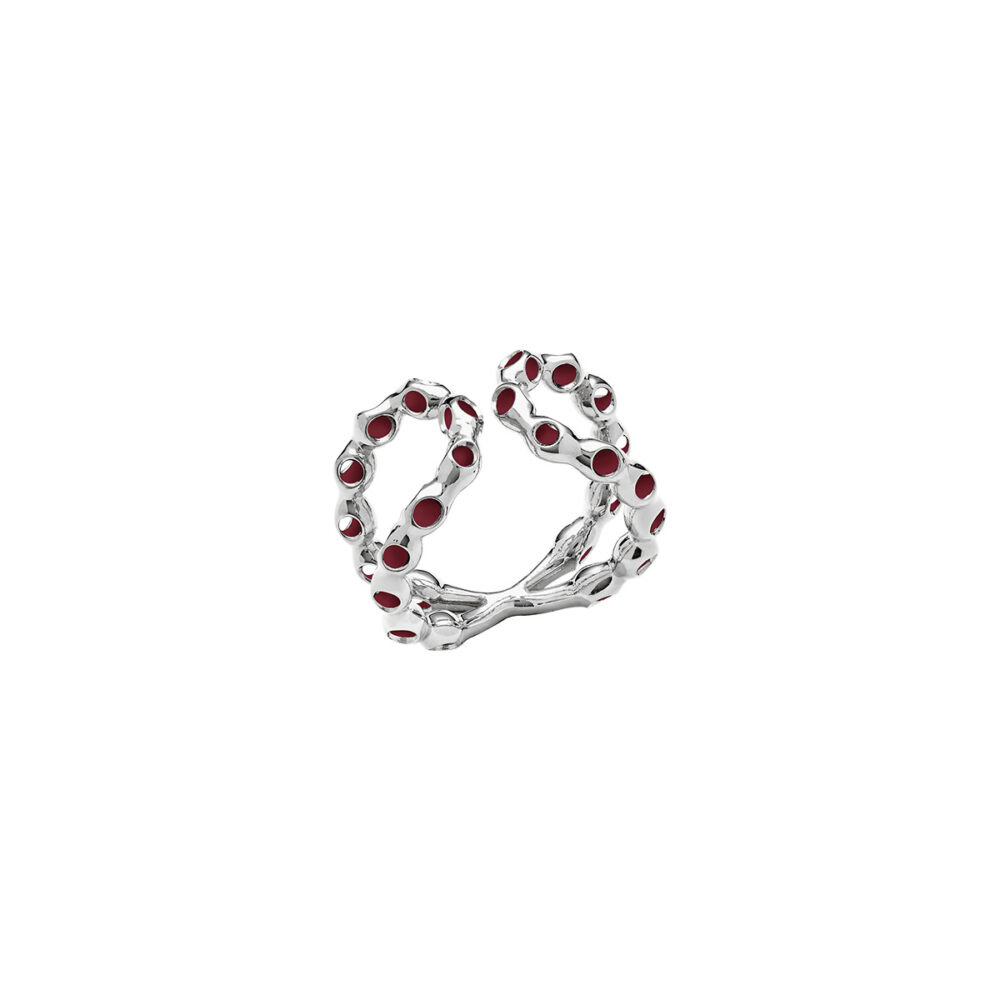 Personalized infinity ring featuring silver metal and red gemstones, stylish accessory for special occasions.