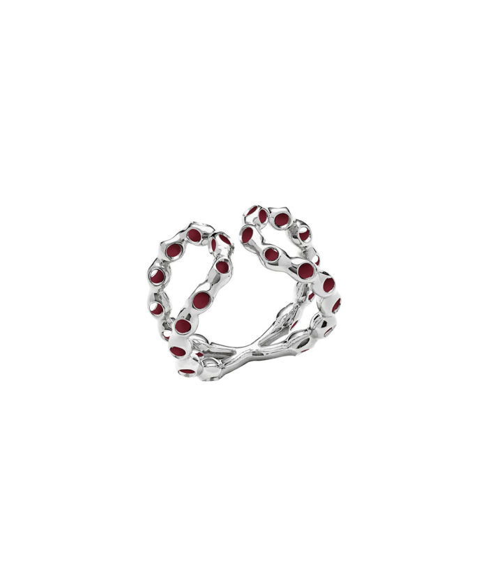 Personalized infinity ring featuring silver metal and red gemstones, stylish accessory for special occasions.