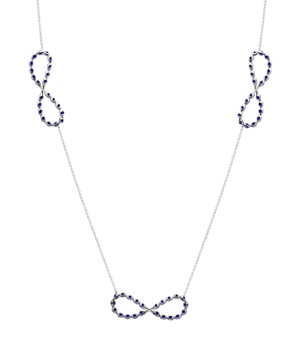 Elegant infinity necklace featuring sterling silver, platinum micron plating, and blue stones.