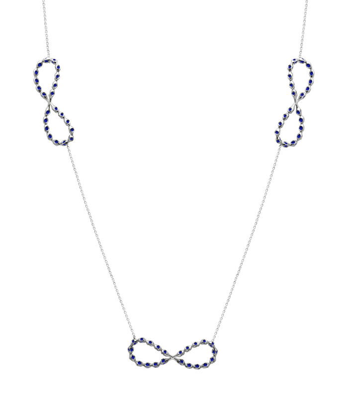 Elegant infinity necklace featuring sterling silver, platinum micron plating, and blue stones.