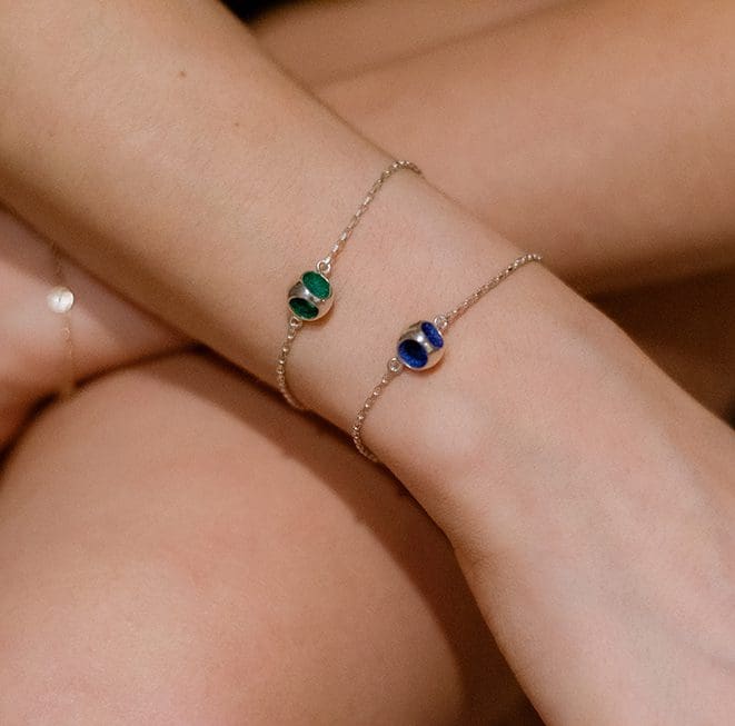 Delicate gold bracelets with colorful circular charms, perfect for elegant and minimalistic jewelry styles.