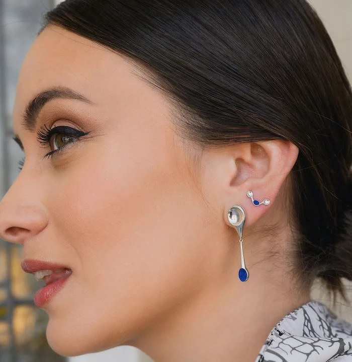 Delicate stem earrings featuring blue and silver accents, perfect for stylish accessories and jewelry lovers.