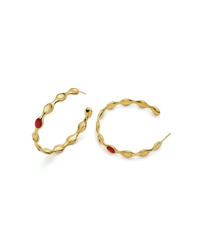 Elegant gold hoop earrings featuring a unique wavy design and red detail for stylish accessories.