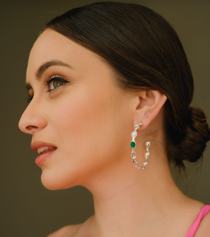 Elegant Monica Varela hoop earring shot.