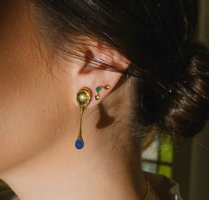 Elegant gold and colorful gemstone earrings by Monica Varela. Perfect for stylish and trendy looks.