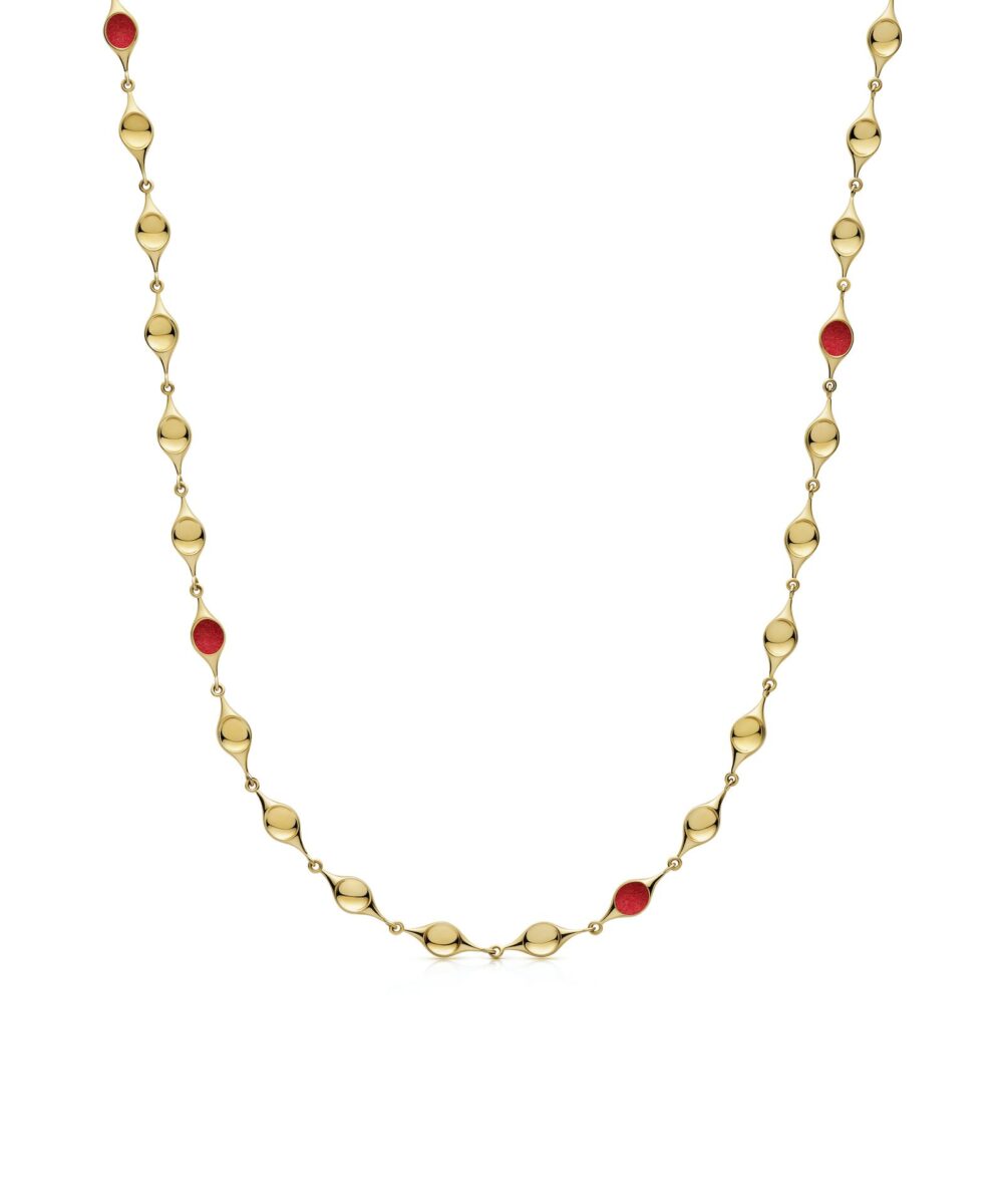 Luxury gold stem necklace featuring red enamel details, perfect for sophisticated styles.