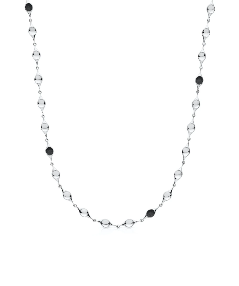 Elegant sterling silver stem necklace with sleek design and black accents for a modern look.