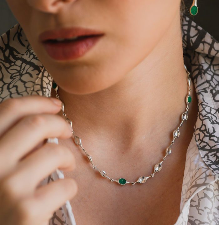 Elegant stem-shaped jewelry with green accents, perfect for enhancing your style.