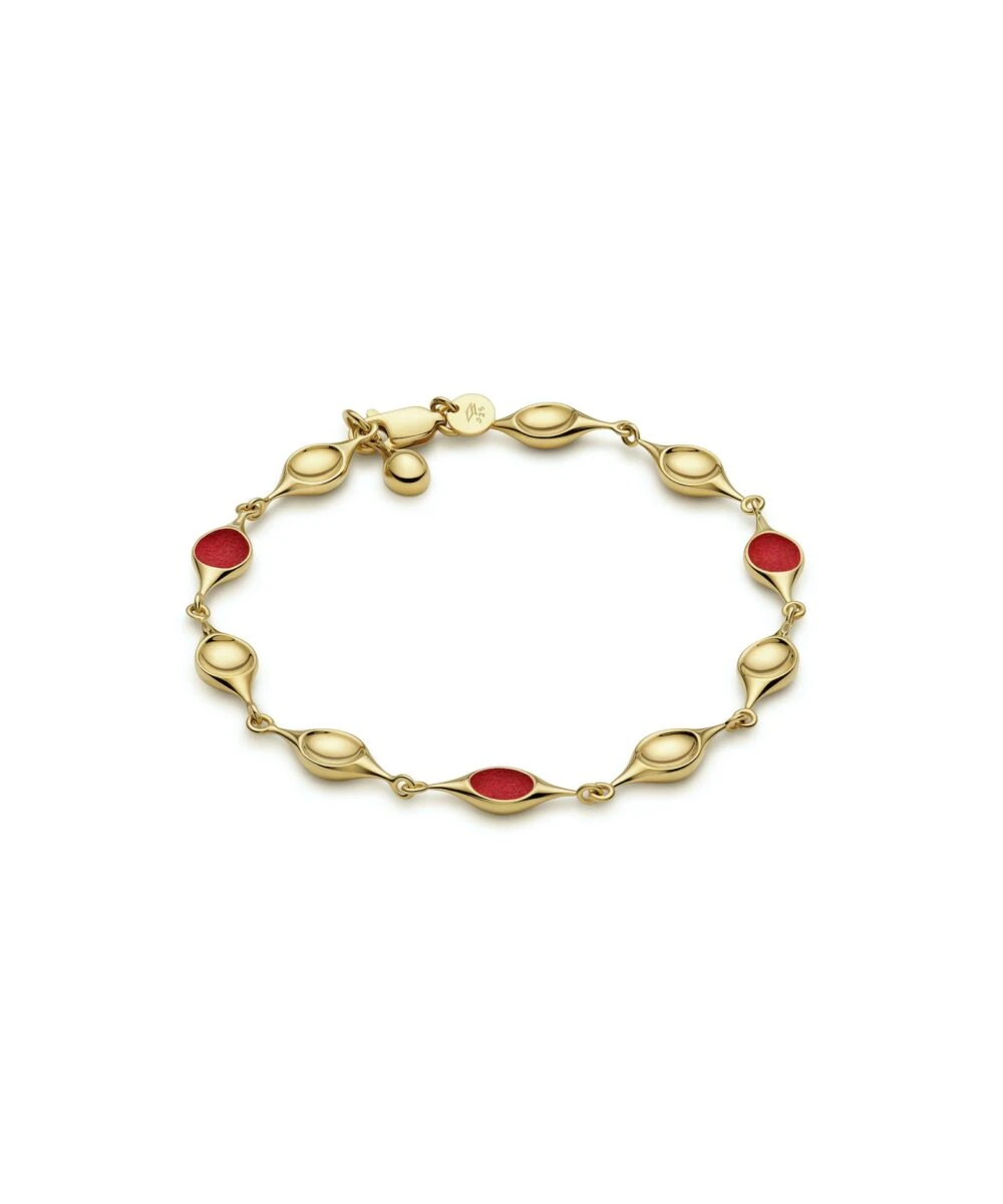 Gold stem bracelet featuring red enamel accents for a stylish and fashionable accessory.