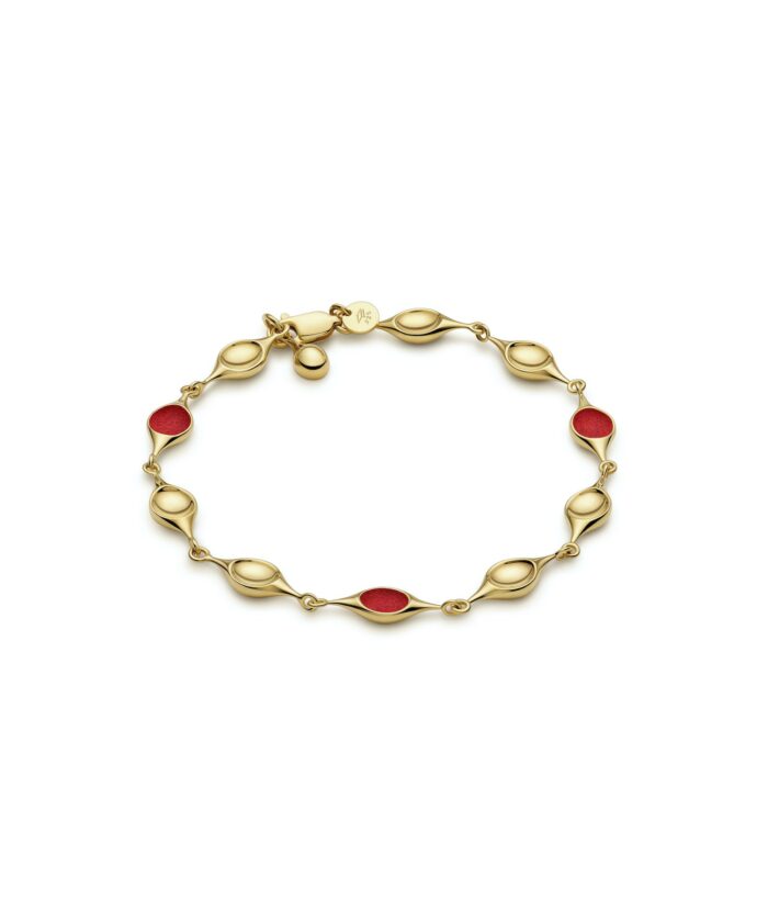 Gold stem bracelet featuring red enamel accents for a stylish and fashionable accessory.