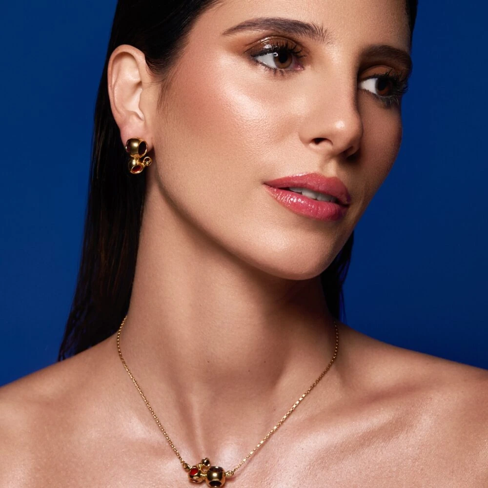 Exquisite Monica Varela jewelry with pendant and earrings, ideal for luxury accessories and statement looks.