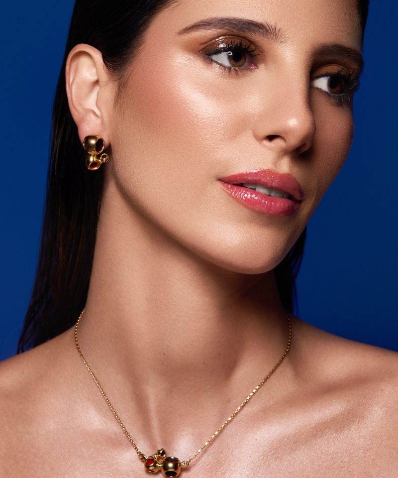 Caurel Triad Stud Earrings in 925 sterling silver with 18k gold plating, worn by model