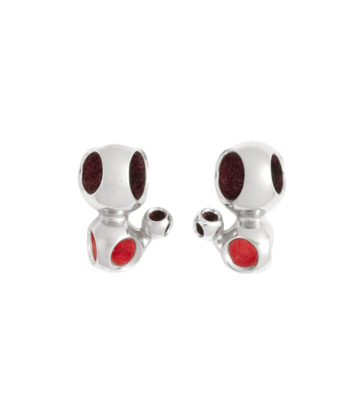 Dog-shaped silver earrings with red accents, jewelry for animal lovers, stylish accessories.