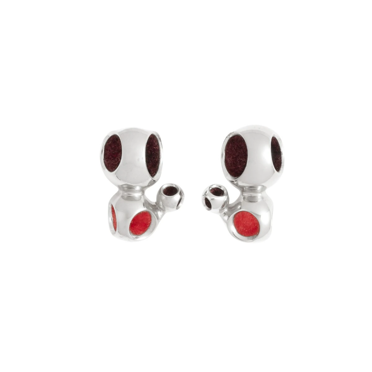 Cute dog-shaped silver earrings with red accents, stylish accessories for animal lovers. Dog-shaped silver earrings with red accents, jewelry for animal lovers, stylish accessories.