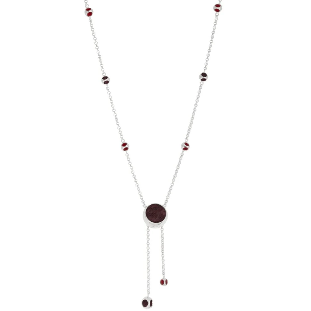Stylish long necklace featuring red beads and a centerpiece, perfect for sophisticated accessories.