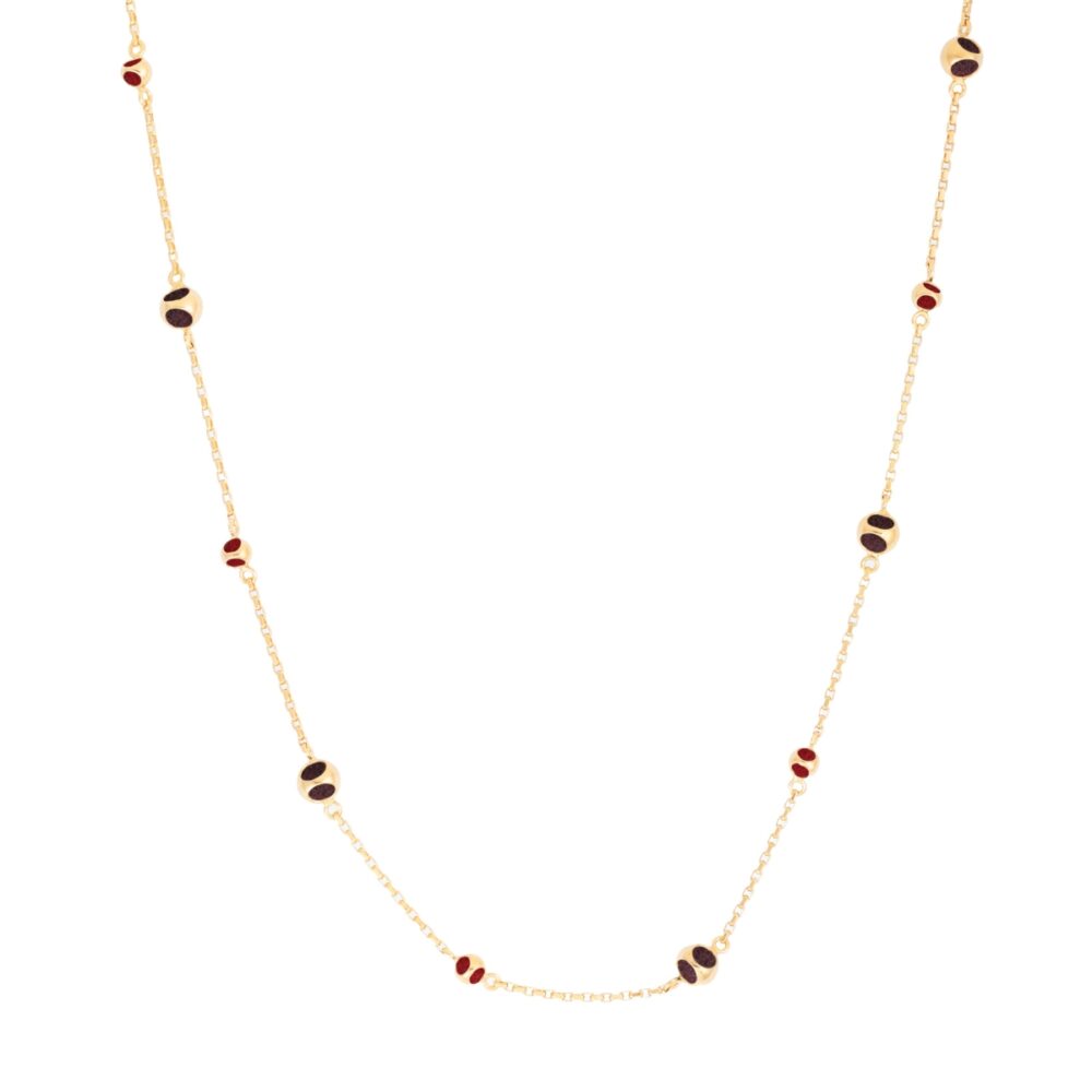 Elegant gold chain with red and black bead accents for a stylish look.