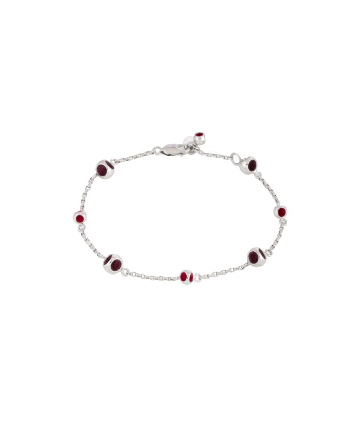 Elegant silver bracelet featuring round red gemstone beads, perfect for stylish accessories.