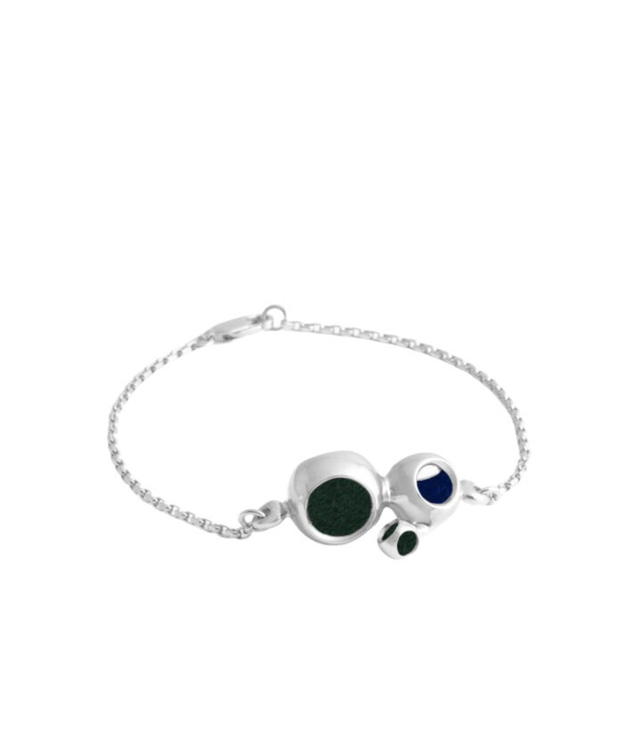 Stylish silver skull bracelet featuring colorful enamel inlays, modern jewelry accessory.