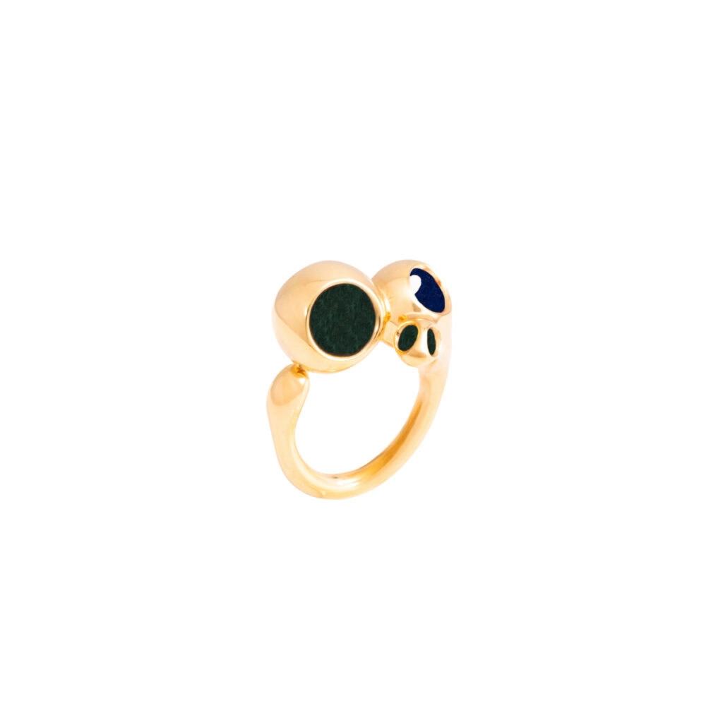 Elegant gold ring featuring three gemstone accents, perfect for stylish accessories.