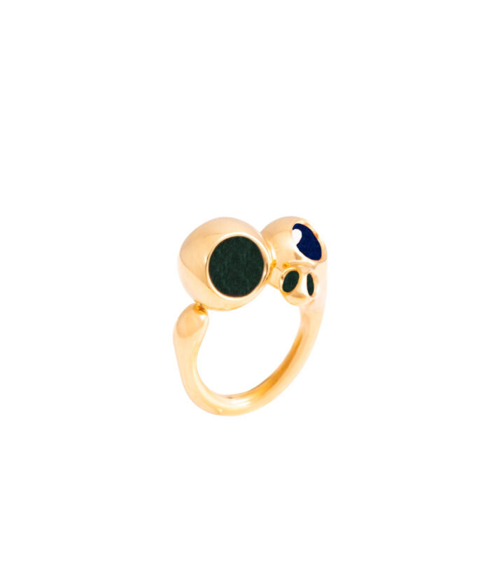 Elegant gold ring featuring three gemstone accents, perfect for stylish accessories.