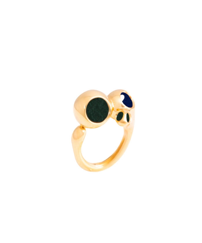 Elegant gold ring featuring three gemstone accents, perfect for stylish accessories.
