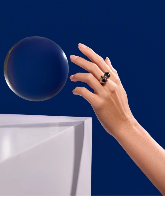 Luxurious jewelry featuring Monaca Varela ring with dark and green gemstones.