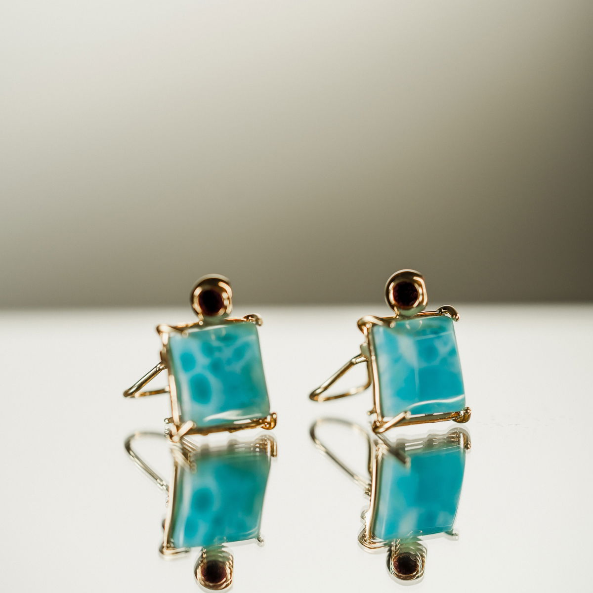 Elegant Turquoise Stud Earrings Gold-plated turquoise square stud earrings, perfect for casual or formal wear.
