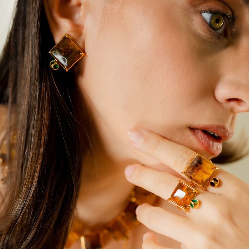 - Stylish amber jewelry earrings and rings for women.