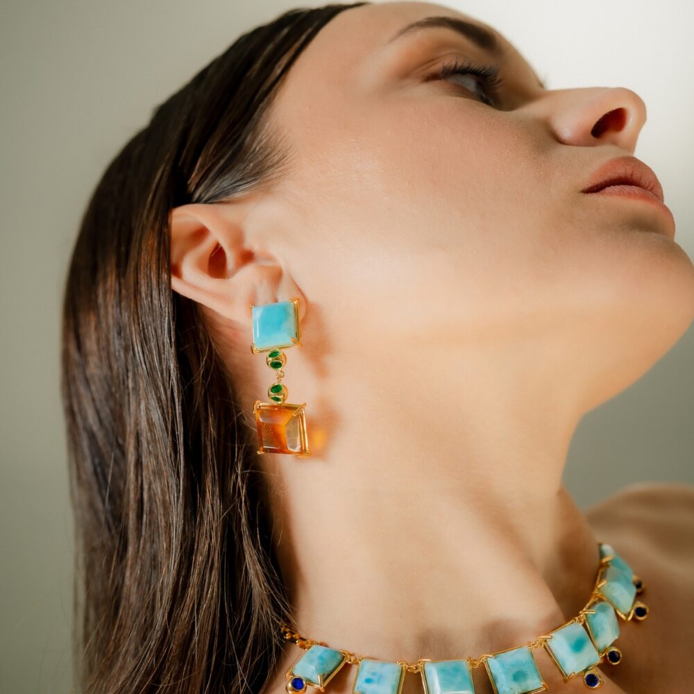 Elegant turquoise and amber dangle earrings with green accents, perfect for stylish jewelry lovers.