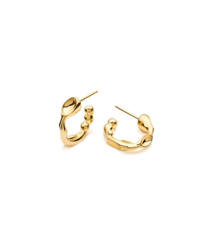 Gold statement earrings with a polished, modern aesthetic and organic curves. Perfect for stylish jewelry accessories.