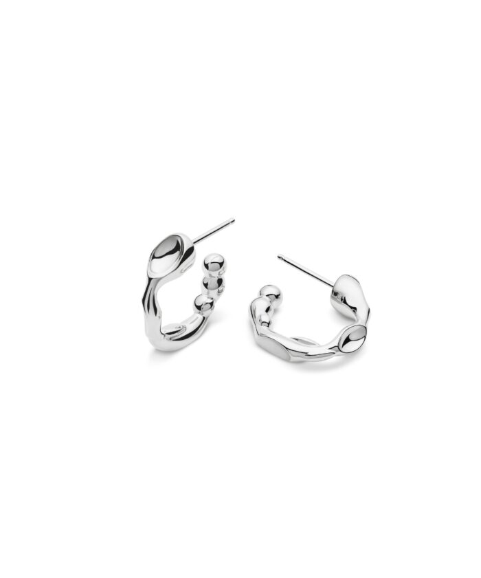 Sterling silver hoop earrings featuring sleek, modern design with beaded accents and polished finish.