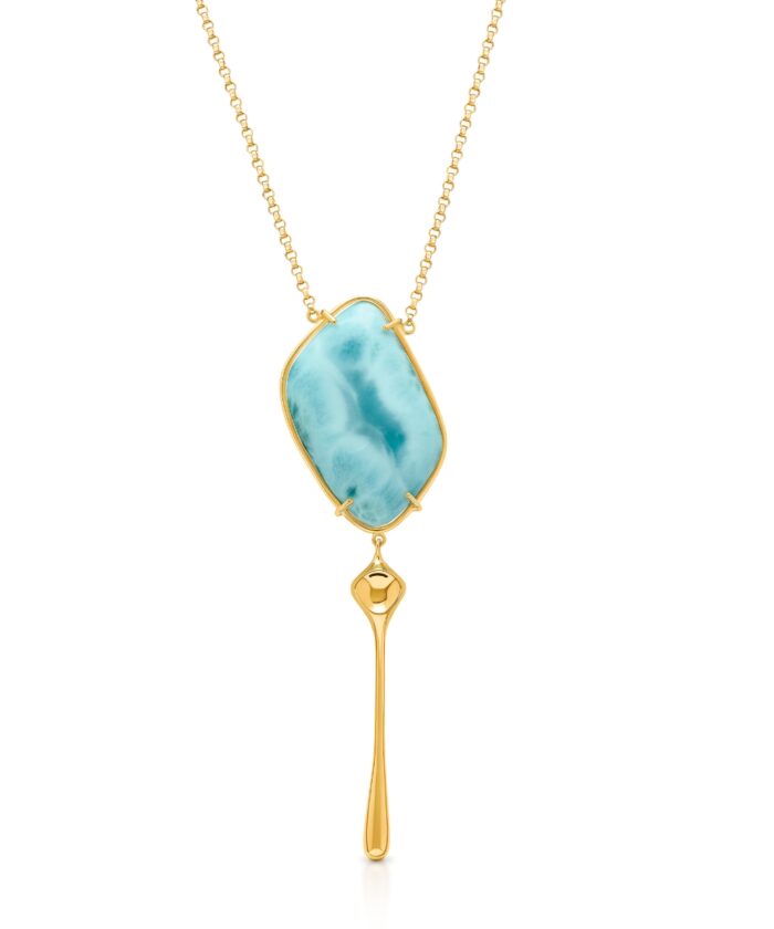 Stylish Larimar jewelry highlighting the stunning blue gemstone with gold setting.