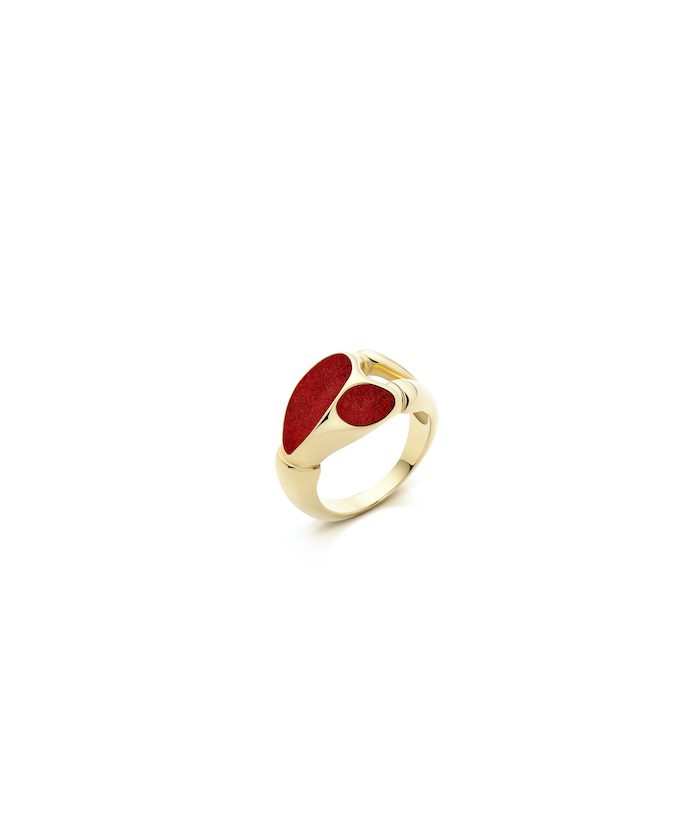 Elegant gold maxi magnet ring with red accents, stylish jewelry accessory.