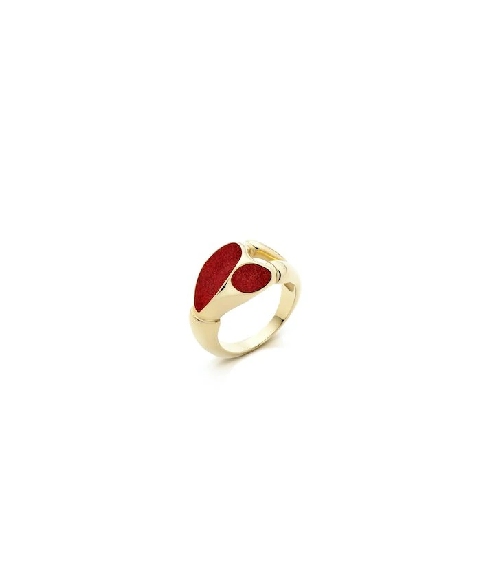 Elegant gold maxi magnet ring with red accents, stylish jewelry accessory.