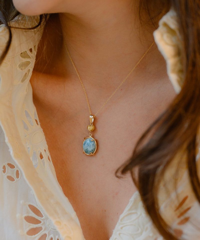 Hislú Larimar Charm in 18k yellow gold, worn by model