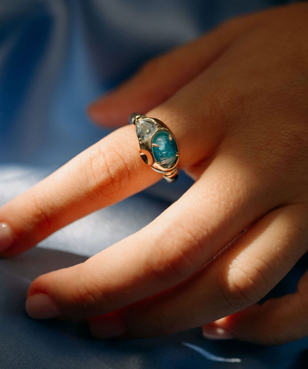 Elegant sterling silver ring with a stunning blue-green tourmaline gemstone. Perfect for jewelry lovers.