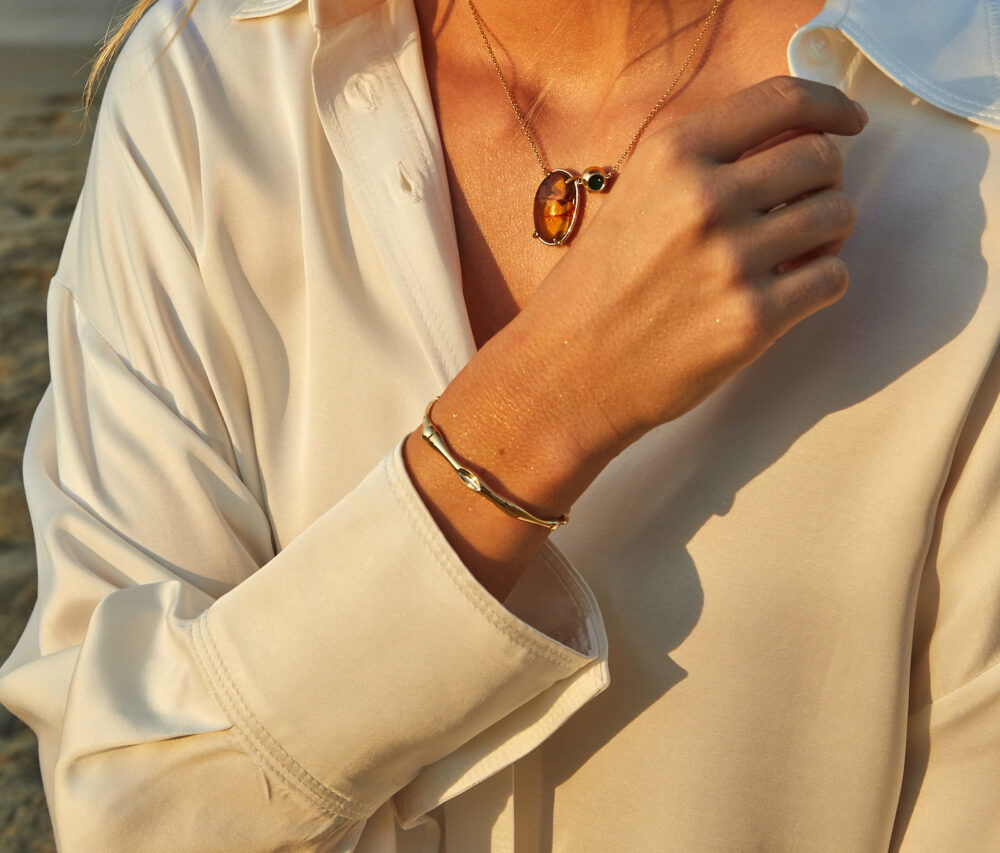 Elegant jewelry featuring necklaces, bracelets, and rings.