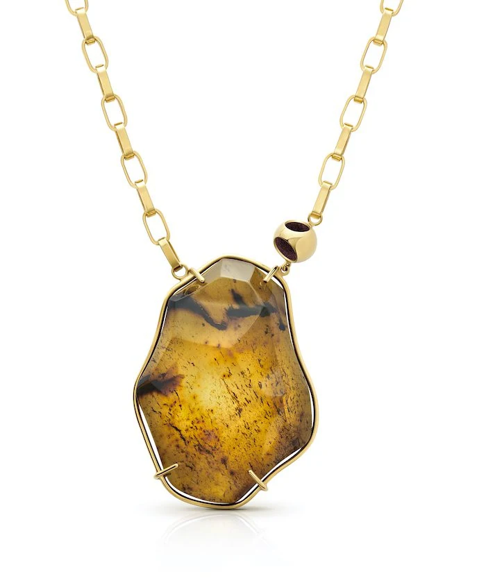 Stunning amber pendant necklace with a unique square chain design, perfect for stylish jewelry lovers.