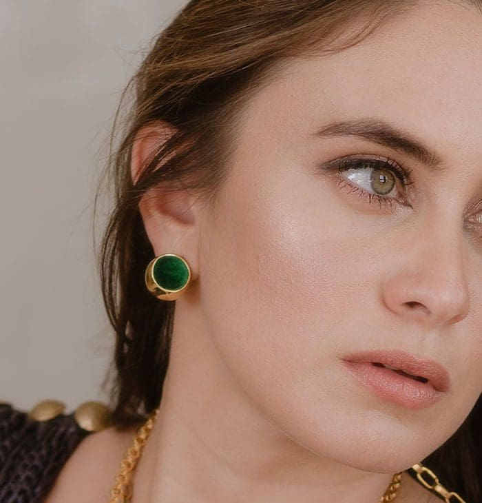 Green and gold sphere earrings for stylish jewelry look. Perfect for adding a touch of elegance to any outfit.