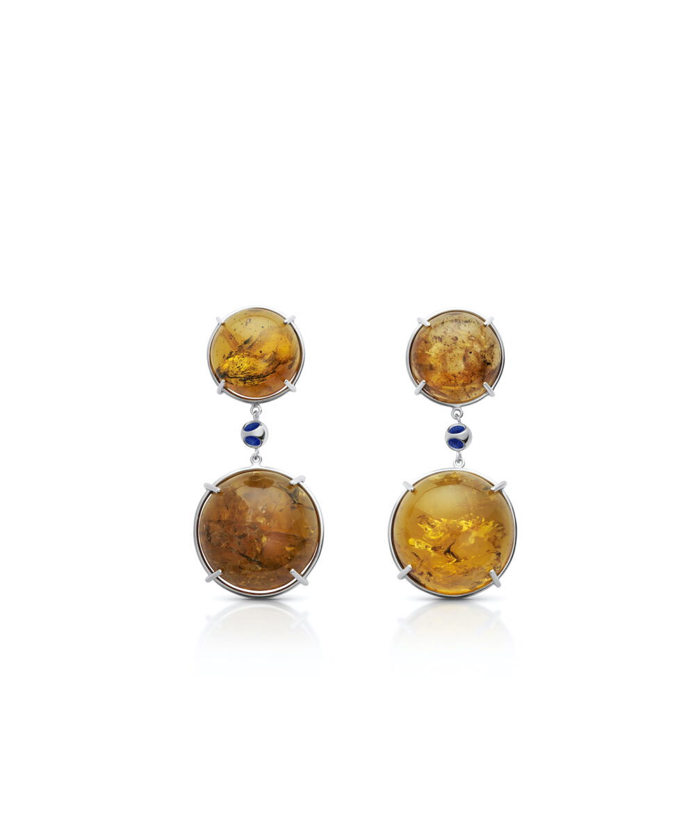 Elegant amber gemstone earrings with silver accents and blue decorative elements, perfect for a sophisticated look.